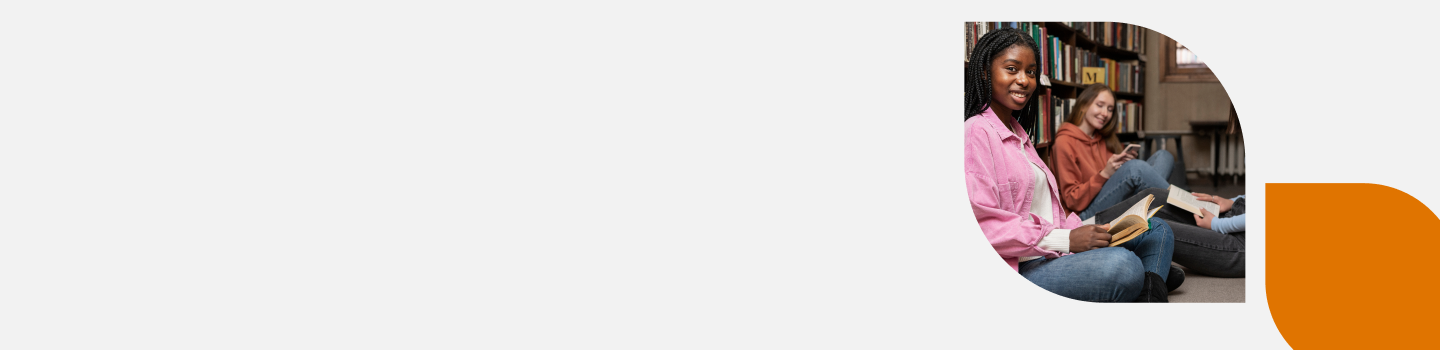 Young people sitting on the floor near bookshelves, reading and using a tablet. One person is wearing a pink jacket and smiling. The group appears relaxed and engaged. The background includes a curved, orange design element.