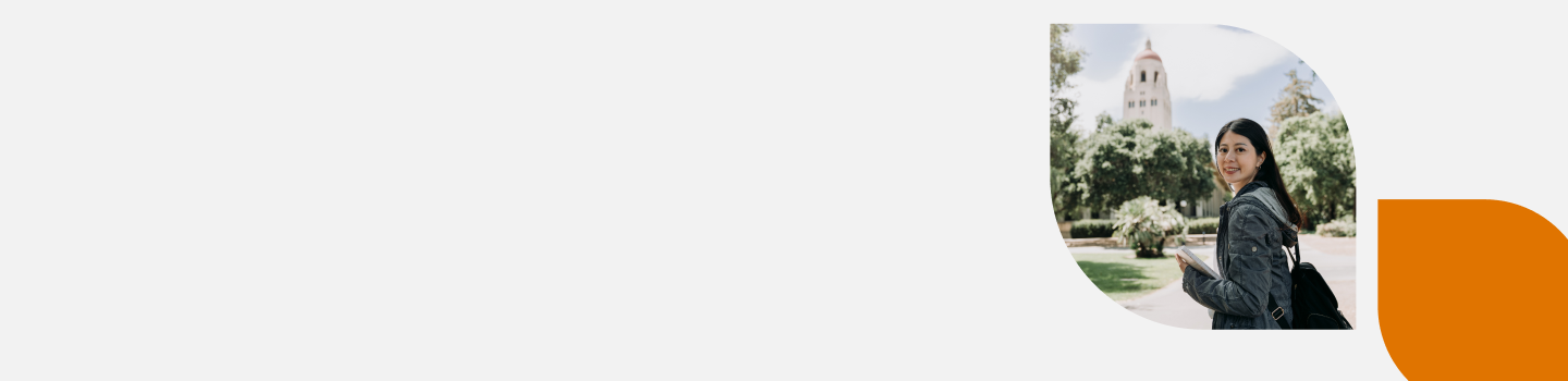 A young woman with long dark hair, wearing a denim jacket, holds a notebook and walks outdoors. She is turning to smile at the camera. In the background, there are trees and a building with a tower. The image is set in a rounded corner frame.